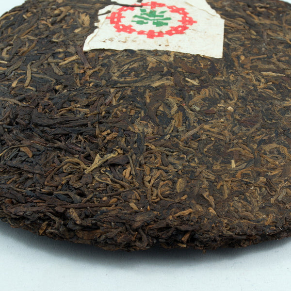 Pu-Erh Tea Cake, "Iron Mold", Import/Export Corporation, 1990s (Raw/Sheng)