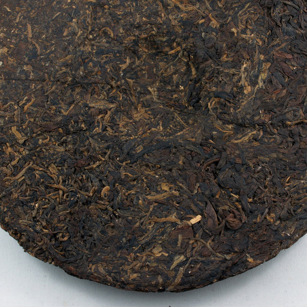 Pu-Erh Tea Cake, "Iron Mold", Import/Export Corporation, 1990s (Raw/Sheng)