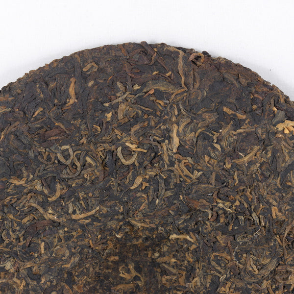 Pu-Erh Tea Cake, "Iron Mold", Import/Export Corporation, 1990s (Raw/Sheng)